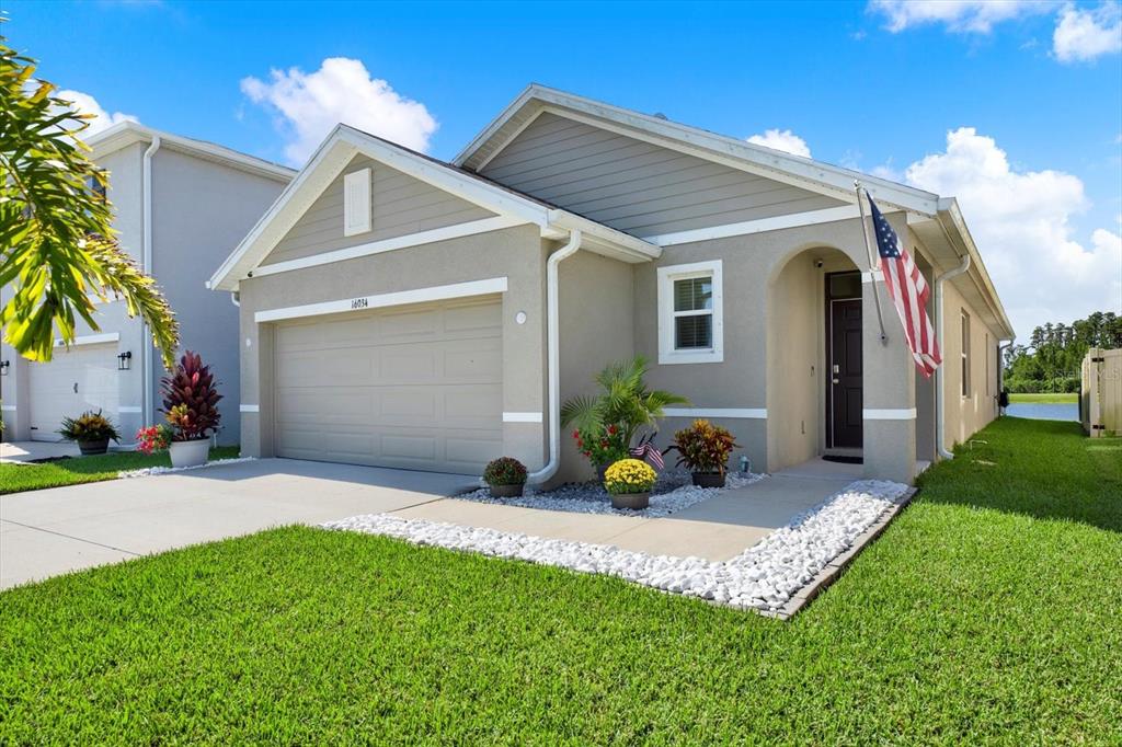 16034 Tuscany Hillside Road Odessa, FL 33556 - Photo 28 of 48 a view of a house with a patio