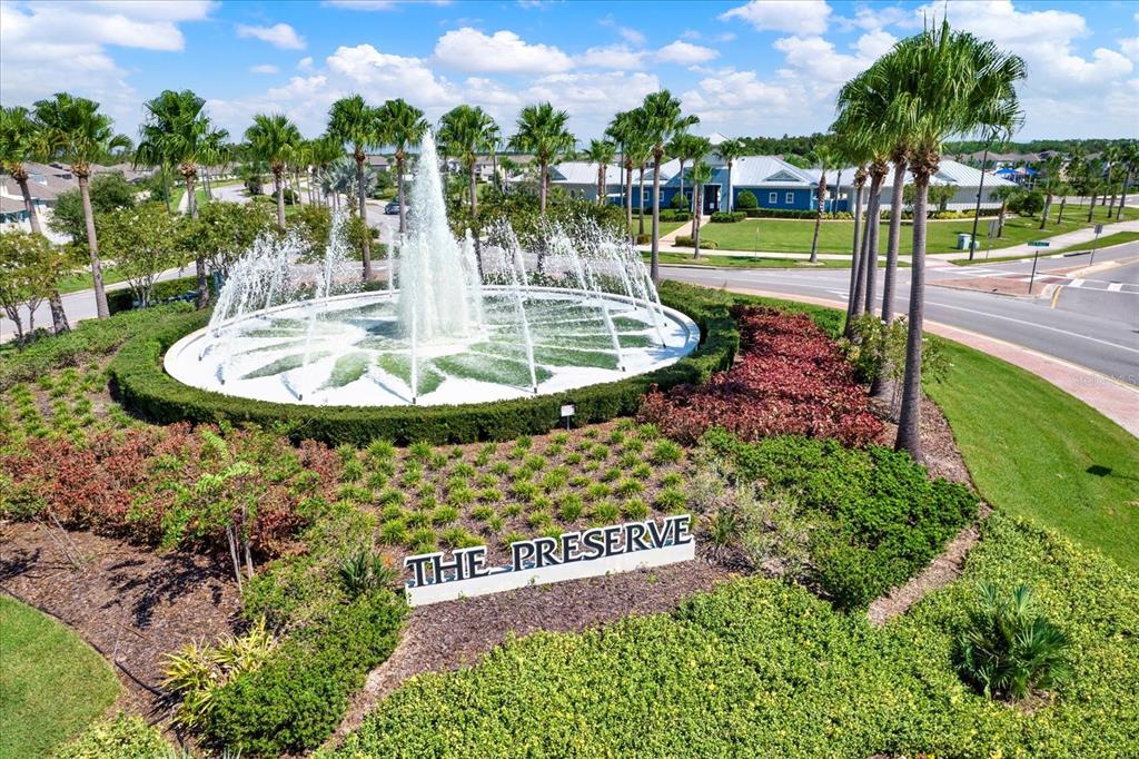 16034 Tuscany Hillside Road Odessa, FL 33556 - Photo 38 of 48 a view of a garden with a fountain