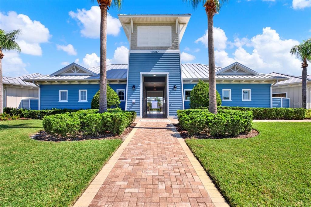 16034 Tuscany Hillside Road Odessa, FL 33556 - Photo 42 of 48 a front view of a brick house with a yard
