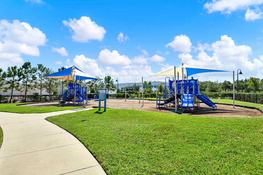 16034 Tuscany Hillside Road Odessa, FL 33556 - Photo 47 of 48 a view of a park with swings and a fire pit