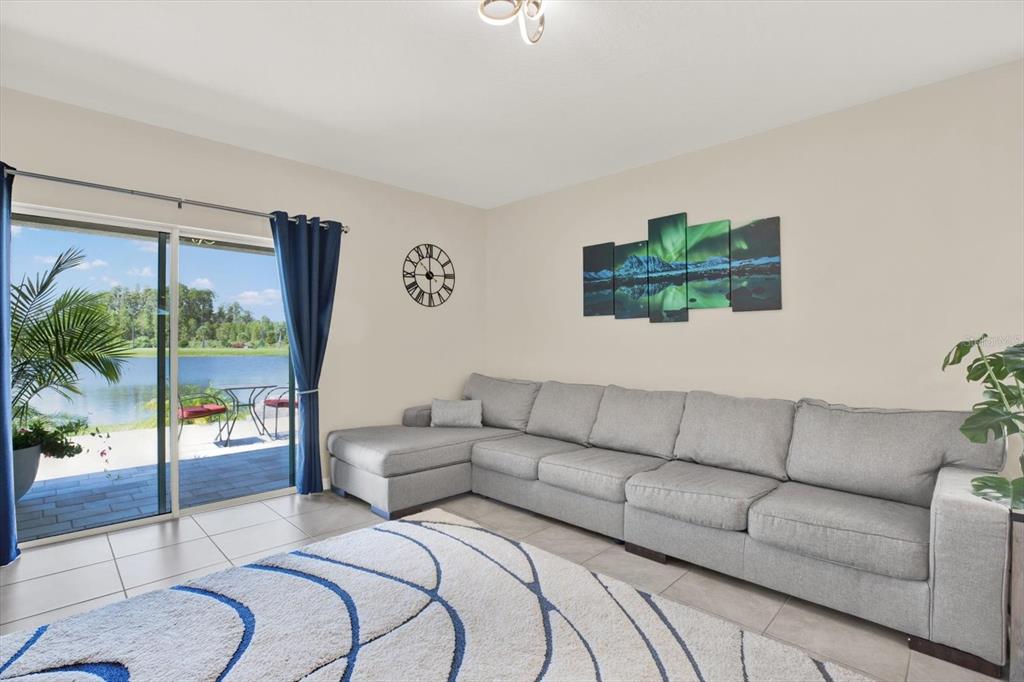 16034 Tuscany Hillside Road Odessa, FL 33556 - Photo 5 of 48 a living room with furniture and a large window