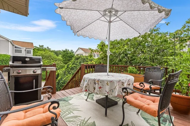 a patio with a patio table and chairs