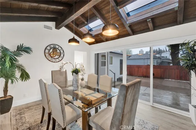 a dining room with furniture and a clock