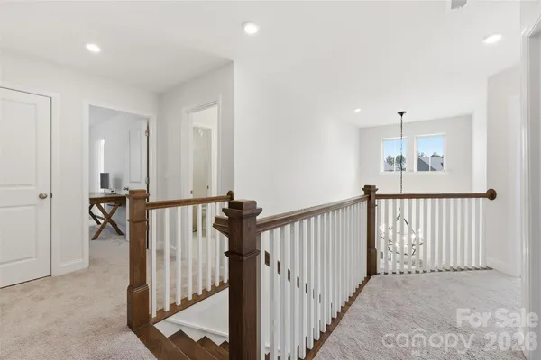 a view of a hallway with a livingroom