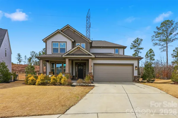 a front view of a house with yard