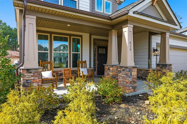 front view of a house with a large window
