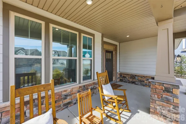a view of balcony with chairs