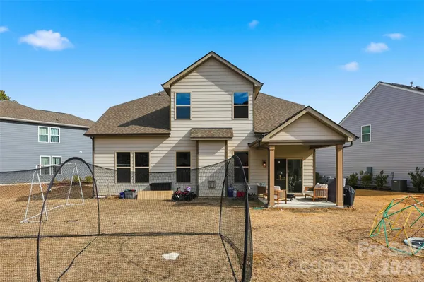 a front view of a house with a patio