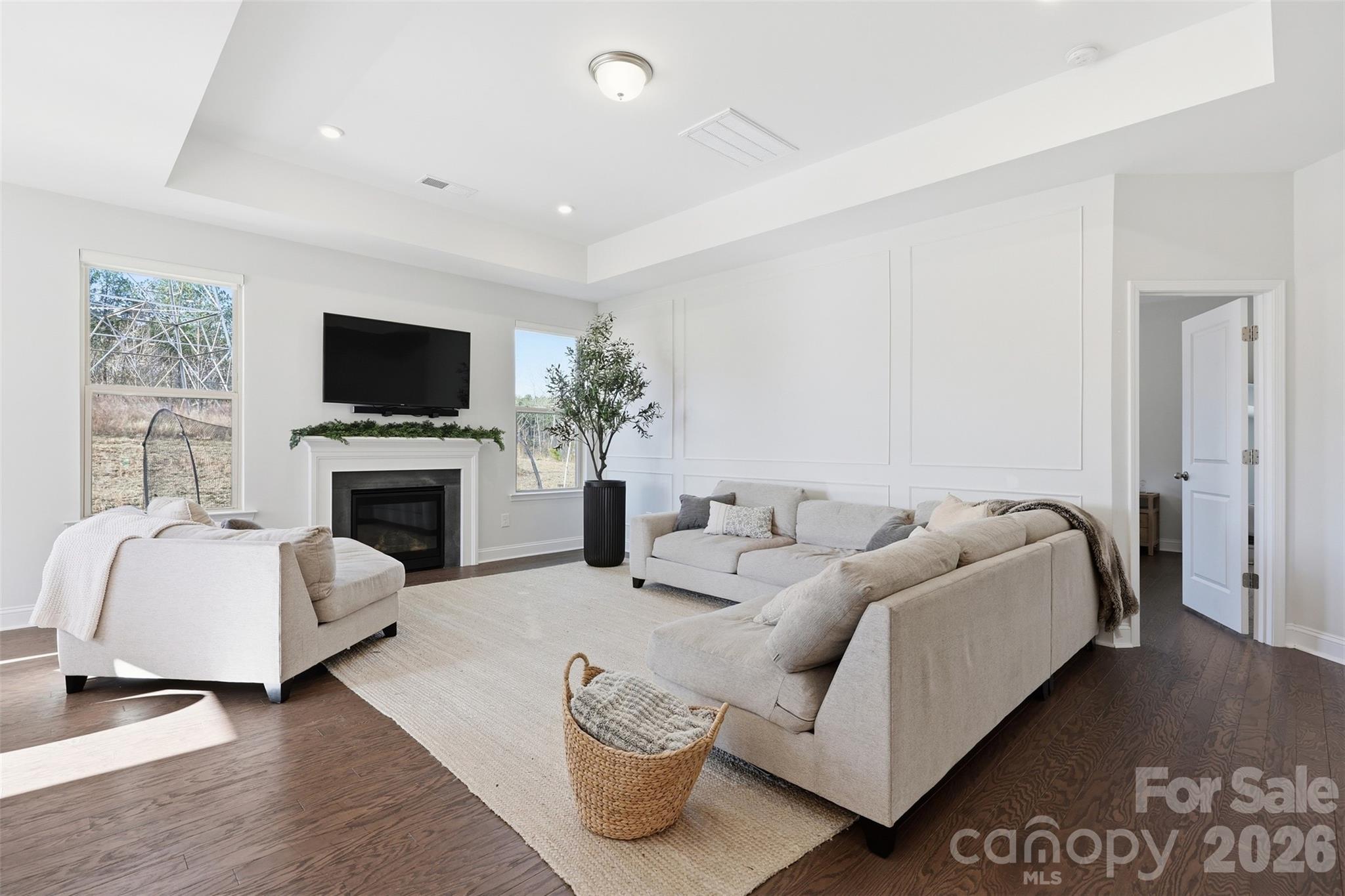 419 Clemson Tree Lane Clover, SC 29710 - Photo 7 of 48 a living room with furniture a flat screen tv and a fireplace