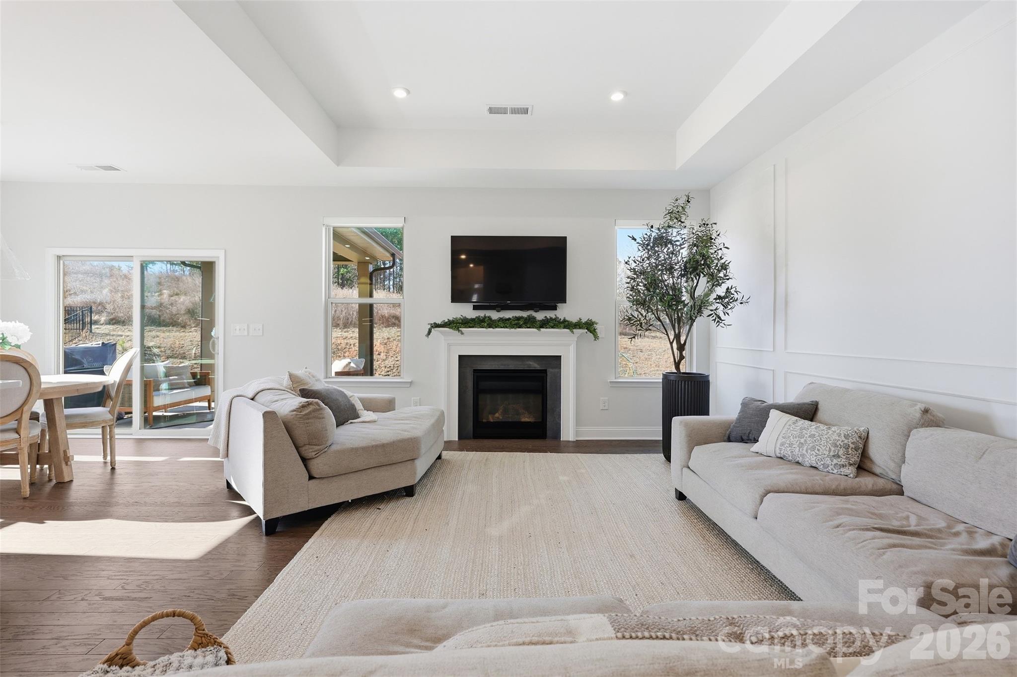 419 Clemson Tree Lane Clover, SC 29710 - Photo 8 of 48 a living room with furniture a fireplace and a flat screen tv