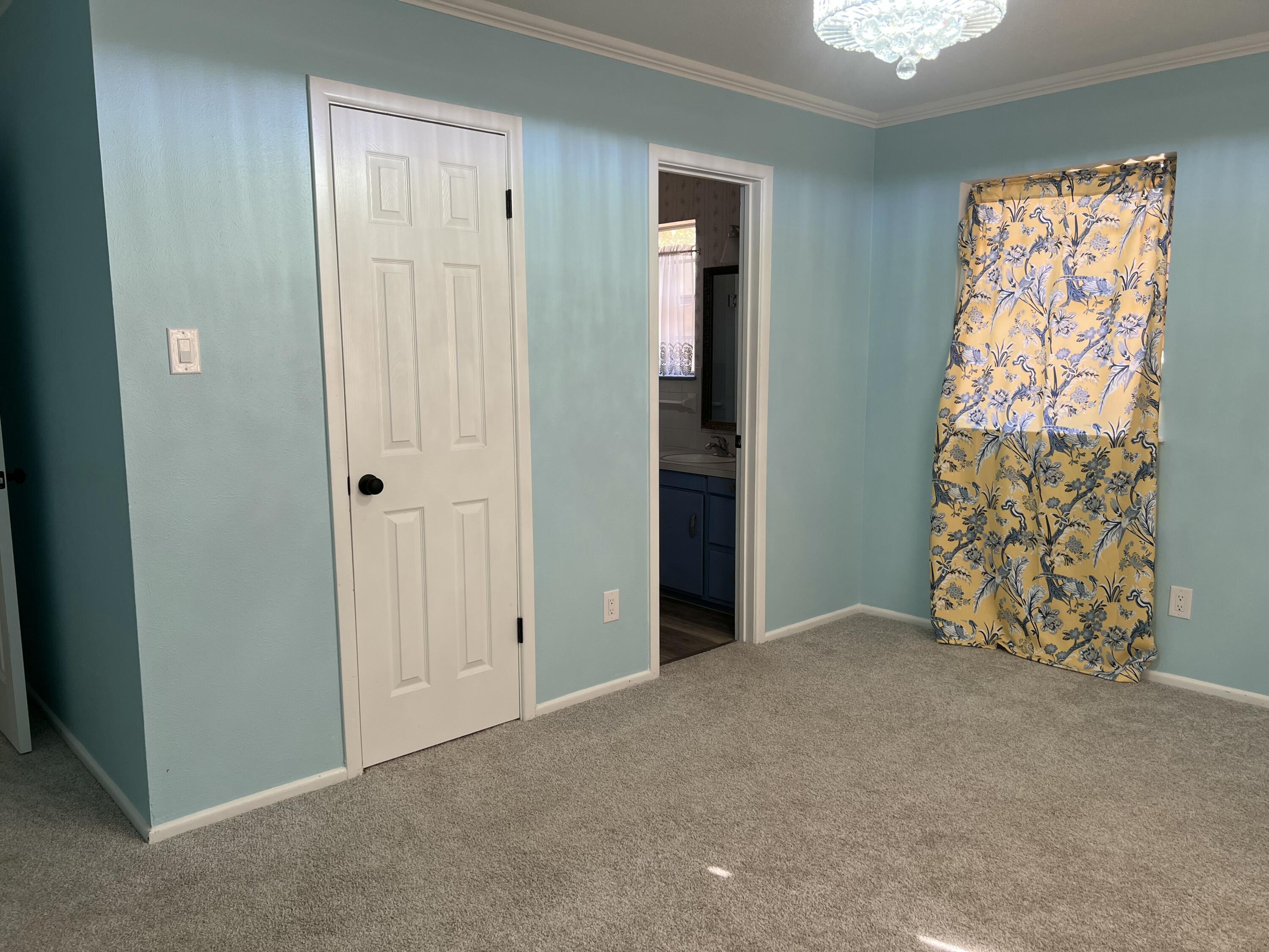 5520 36th Street Lubbock, TX 79407 - Photo 13 of 27 a view of an empty room with a window