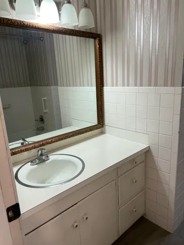 a bathroom with a bathtub and shower