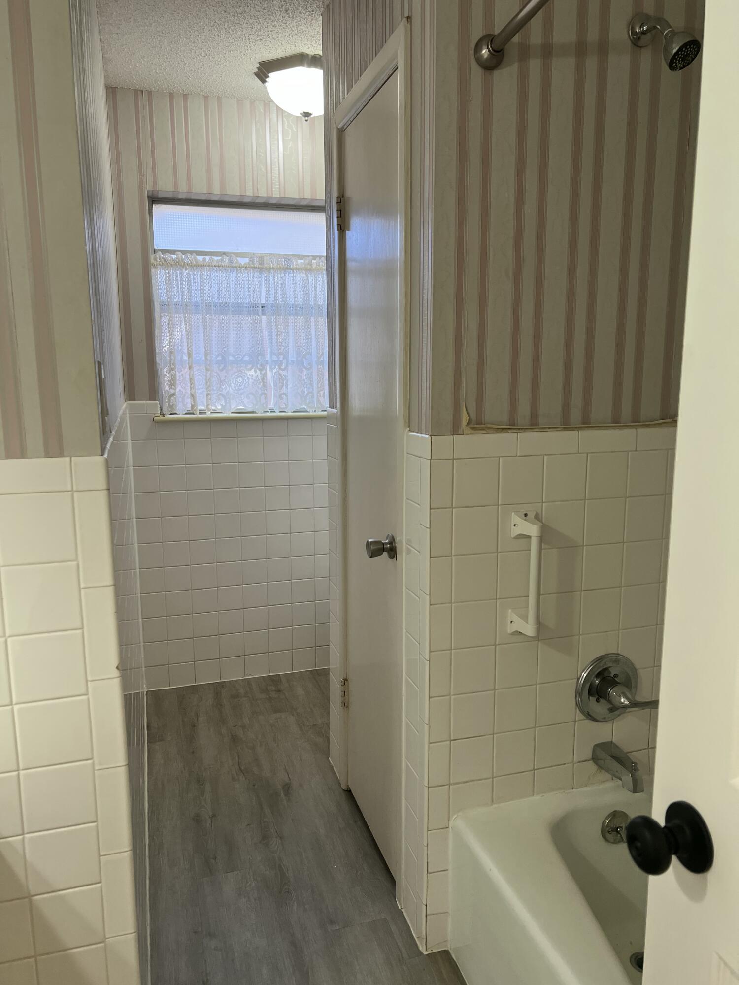 5520 36th Street Lubbock, TX 79407 - Photo 18 of 27 a bathroom with a bathtub and shower