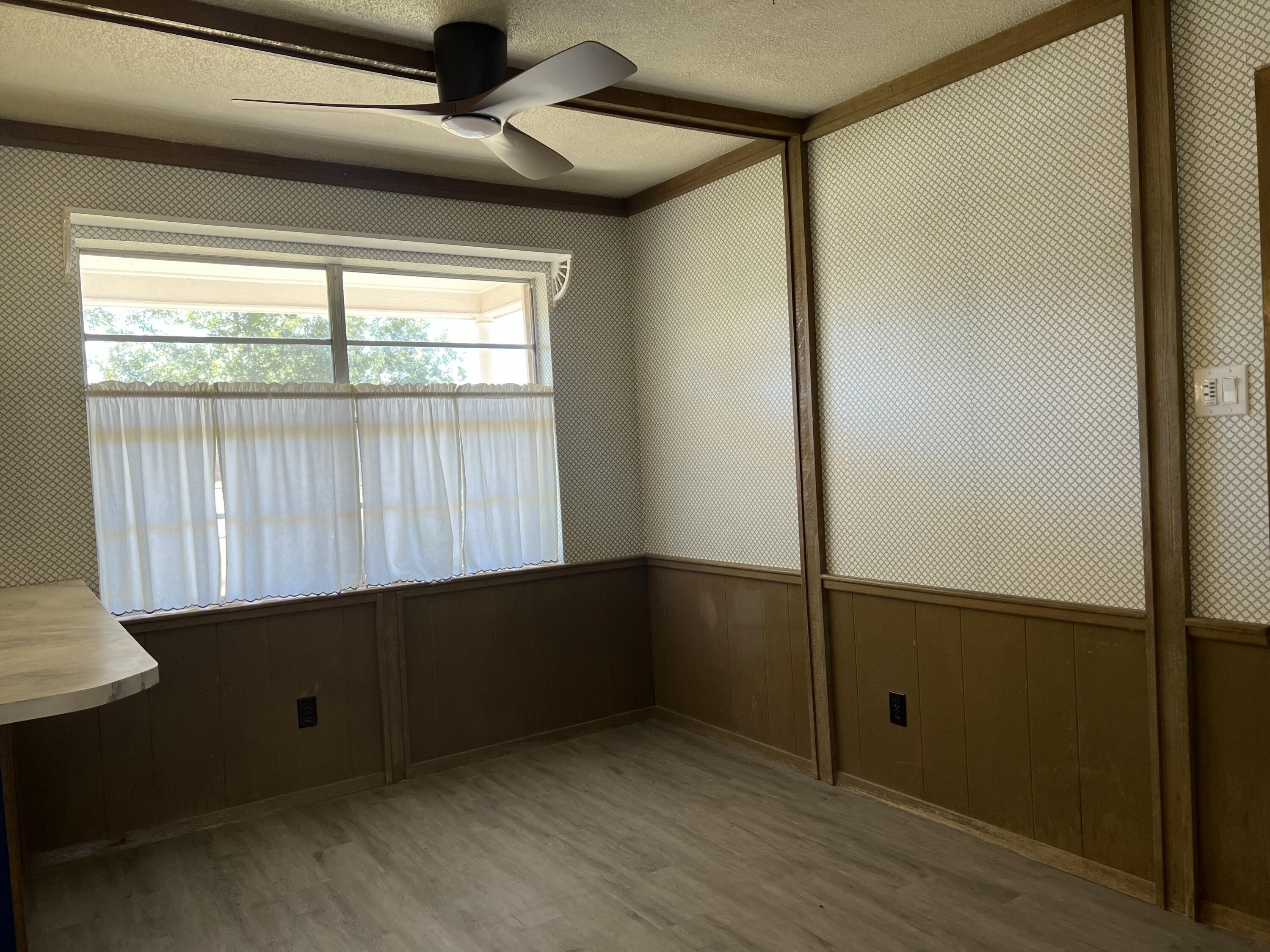 5520 36th Street Lubbock, TX 79407 - Photo 8 of 27 a view of an empty room and window