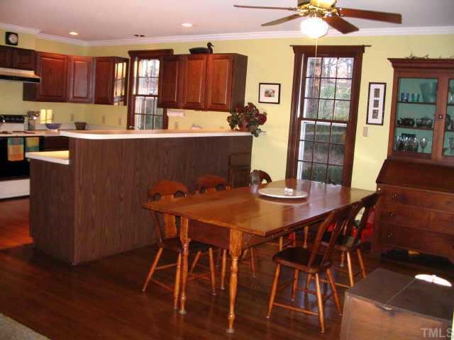 6202 Arrington Road Raleigh, NC 27607 - Photo 10 of 10 a view of a dining room with furniture and wooden floor