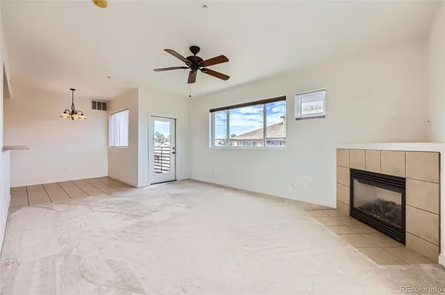 a kitchen with granite countertop a sink and a refrigerator