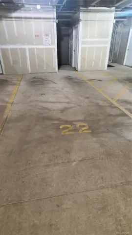 a view of parking garage with cars