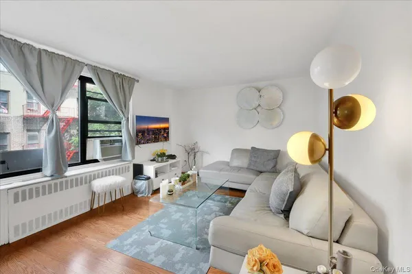 a living room with furniture and a large window