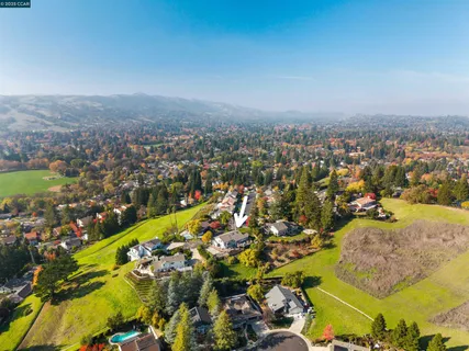 an aerial view of residential building and an ocean