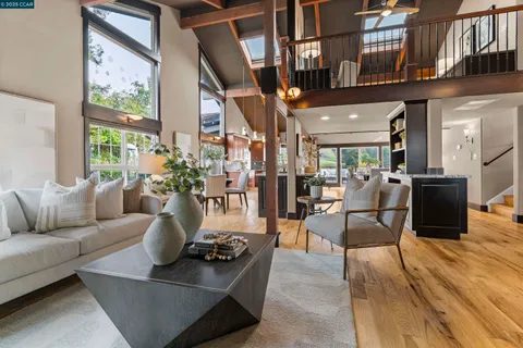 a view of a dining room with furniture wooden floor and a rug