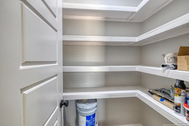 a bathroom with a granite countertop sink mirror vanity and toilet