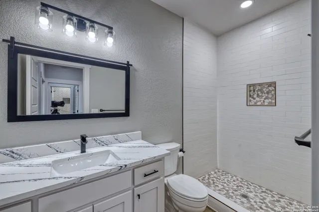 an empty room with a window and a ceiling fan