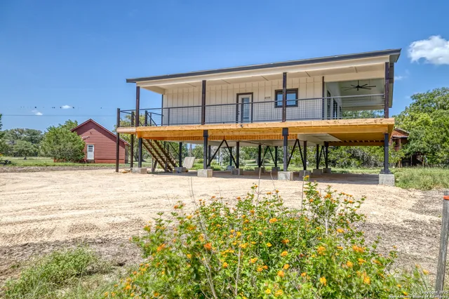 a view of swimming pool with outdoor seating