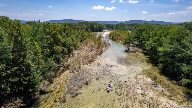 a view of a lake with a yard