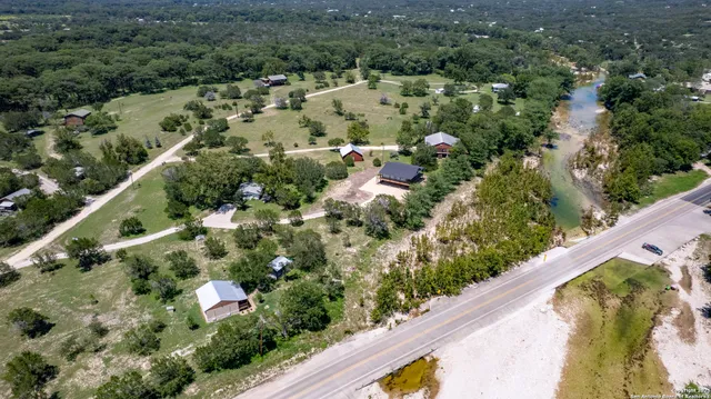 a view of a house with yard and a garden