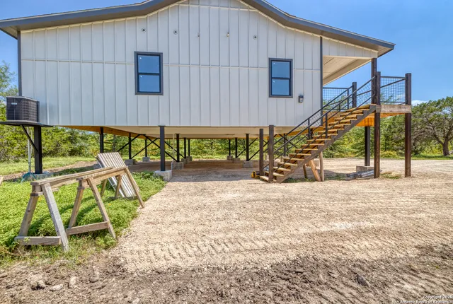 a view of balcony with wooden floor