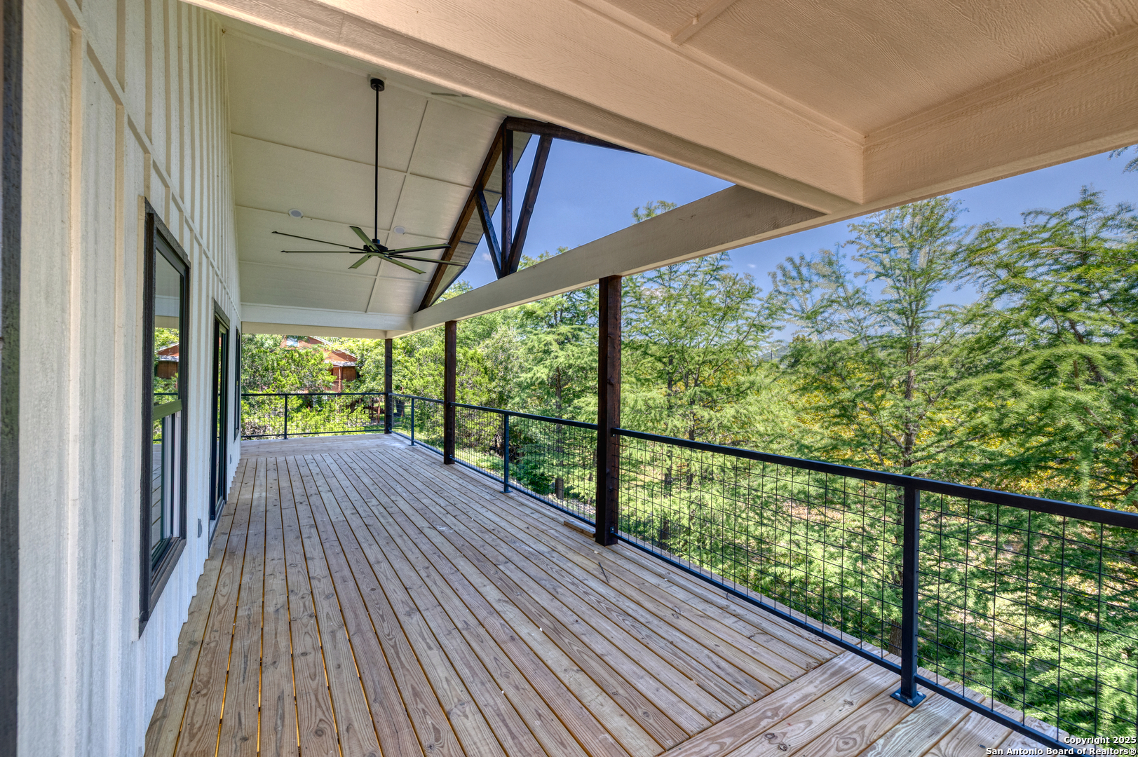 132 Sherman Lane Leakey, TX 78873 - Photo 8 of 50 a view of a balcony with wooden floor