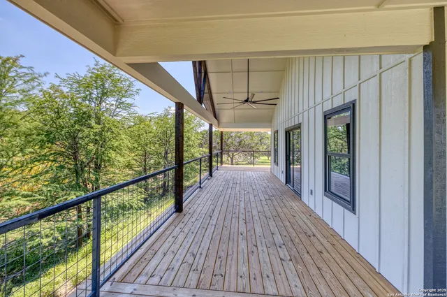 a view of porch with wooden floor