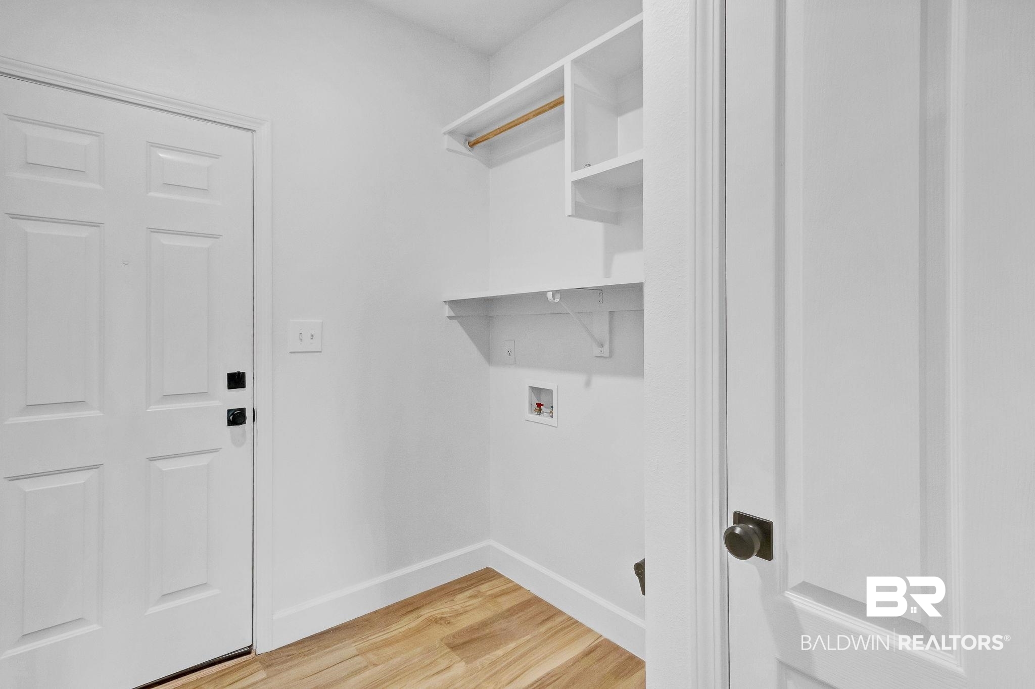 20265 Erin Pond Road Seminole, AL 36574 - Photo 37 of 97 Washroom featuring baseboards, light wood-type flooring, laundry area, and hookup for a washing machine