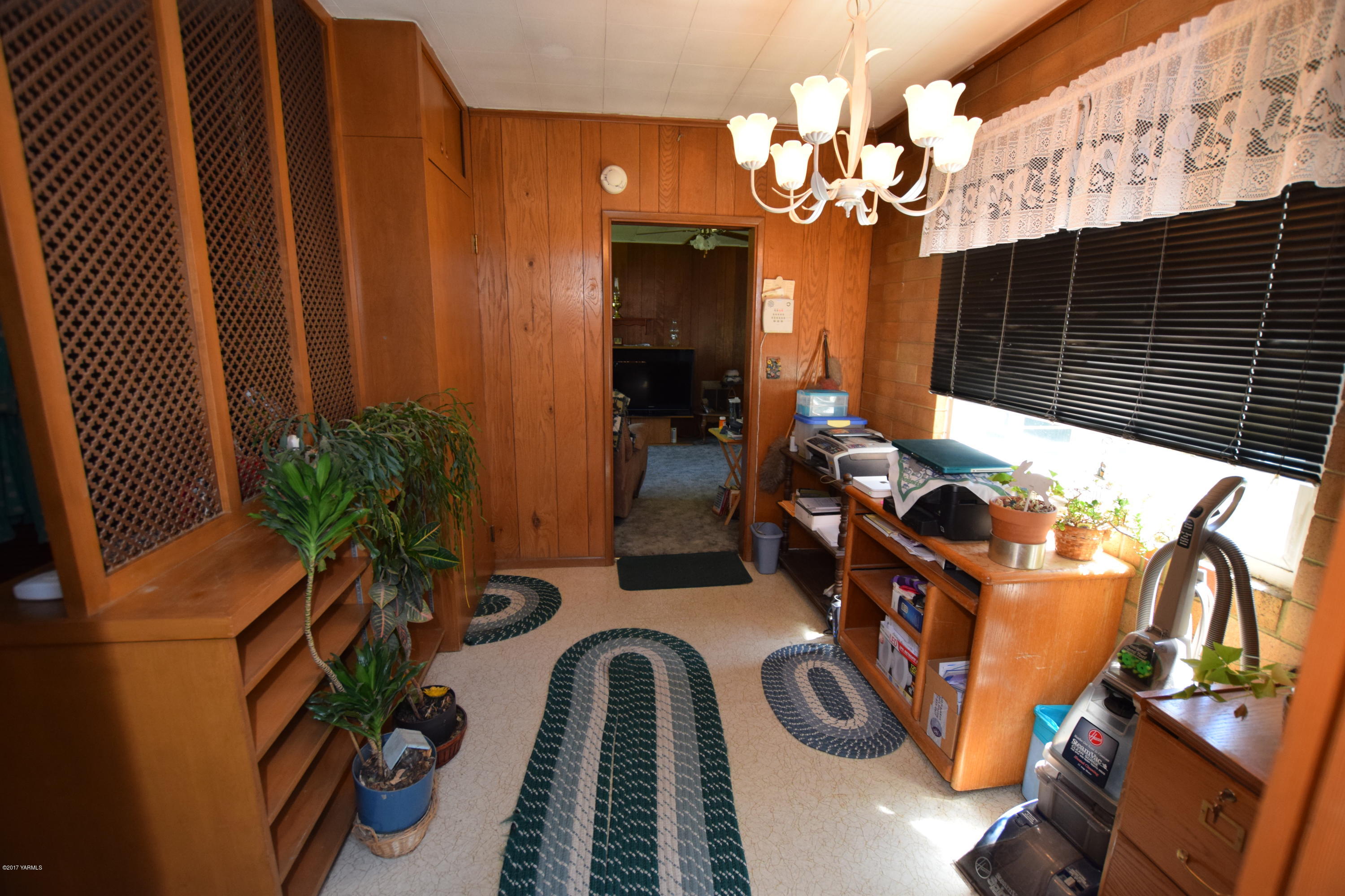 13760 Rutherford Road Yakima, WA 98903 - Photo 10 of 25 a vase of flowers sitting on a table in front of a door
