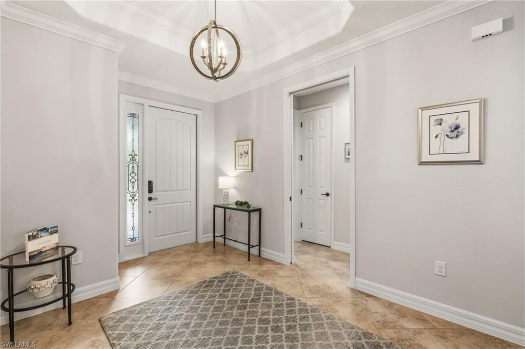 12614 Fenhurst Way Naples, FL 34120 - Photo 18 of 44 Entrance with pocket door leading to 2 guest bedrooms