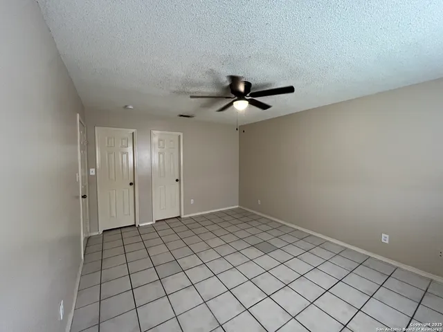 a bathroom with a sink a toilet a mirror and shower