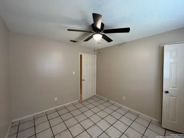 en empty room with fan
