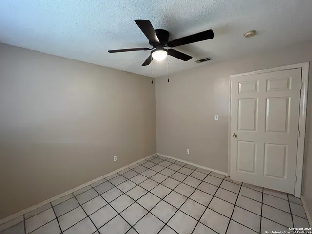 a bathroom with a shower and a toilet