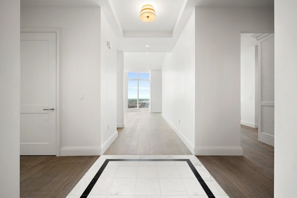 240 Devonshire Street, Unit PH 2C Boston, MA 02110 - Photo 3 of 42 a view of a hallway with wooden floor