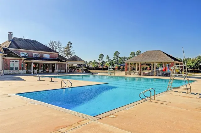 a view of a house with swimming pool