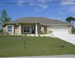 337 Corrientes Circle Punta Gorda, FL 33983 - Photo 1 of 1 a front view of a house with garden
