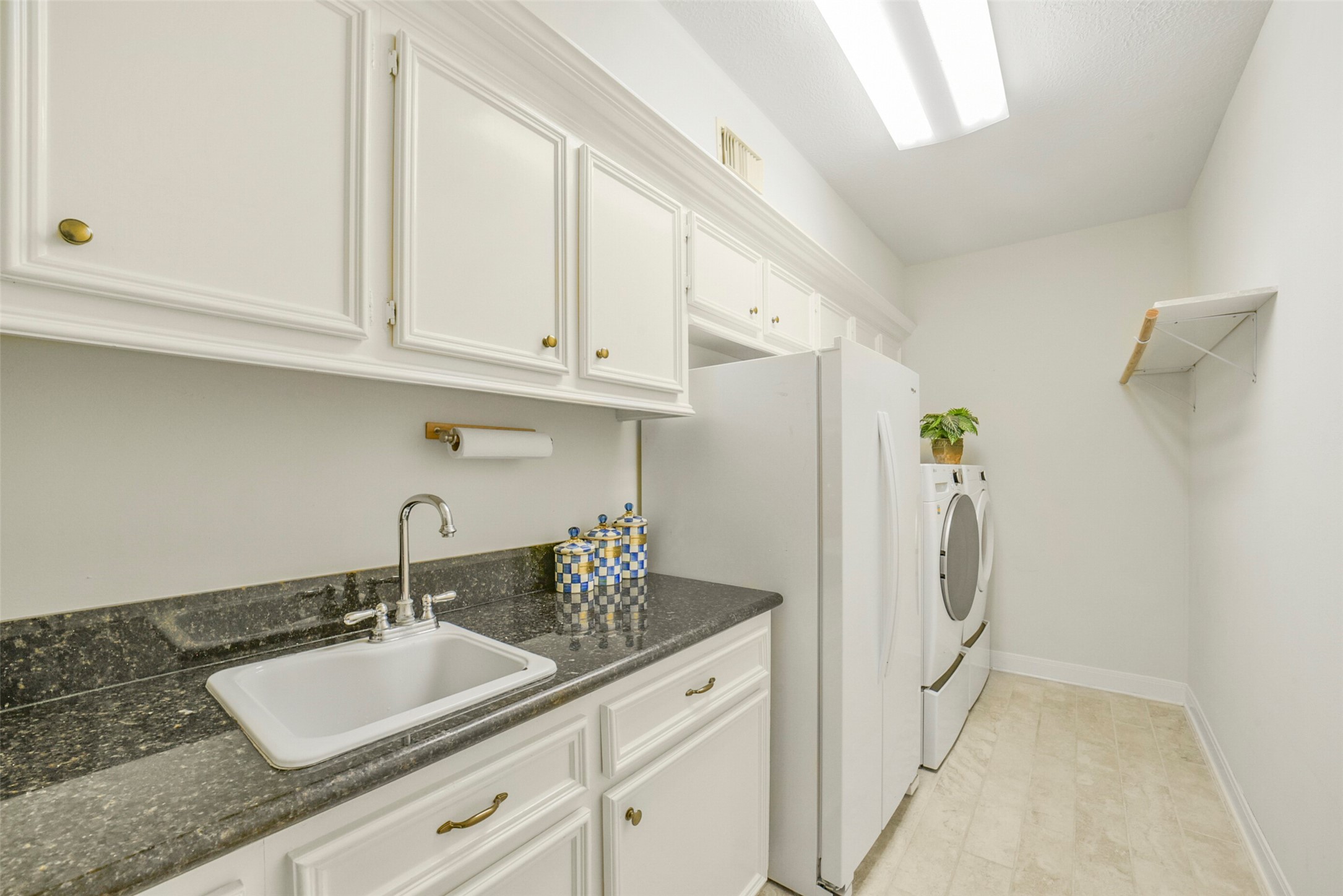 17302 Atherington Place Spring, TX 77379 - Photo 22 of 50 Oversized laundry room with space for a second fridge, sink and cabinetry.