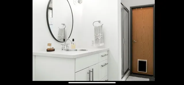 a bathroom with a sink and a mirror