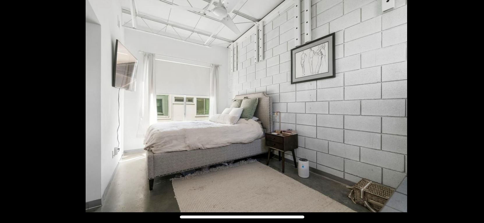 4801 South Congress Avenue, Unit F4 Austin, TX 78745 - Photo 14 of 22 a bed sitting in a bathroom next to a bathroom