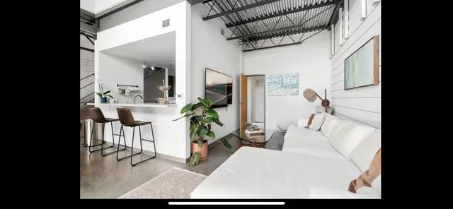 a living room with furniture and a table