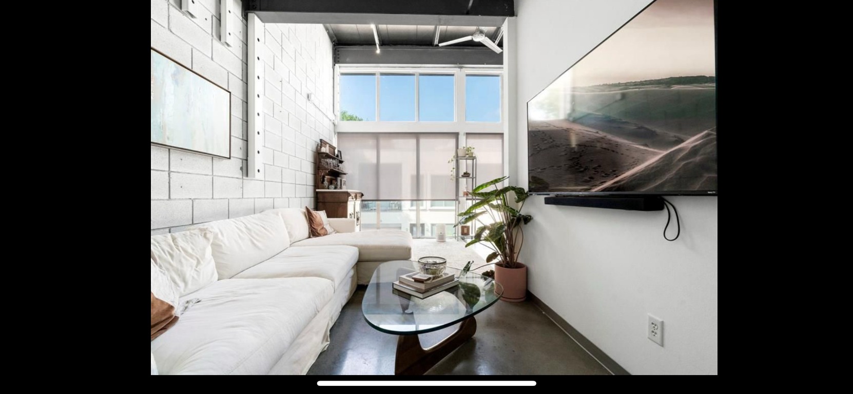 4801 South Congress Avenue, Unit F4 Austin, TX 78745 - Photo 7 of 22 a living room with furniture and a potted plant