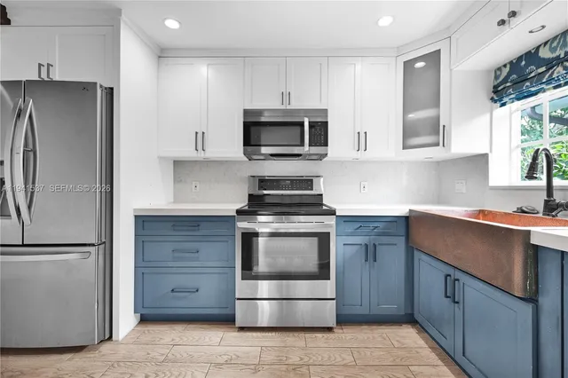 a kitchen with a stove microwave and refrigerator