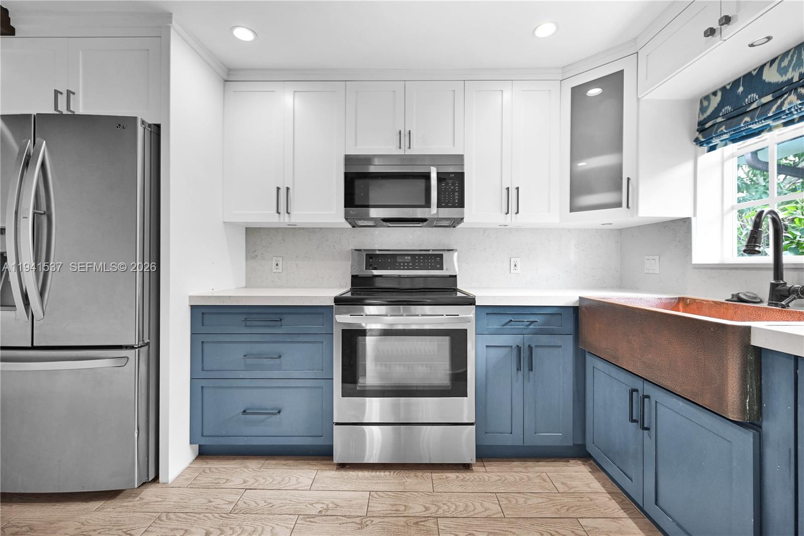 6560 Southwest 39th Street Miami, FL 33155 - Photo 12 of 17 a kitchen with granite countertop a refrigerator and a sink