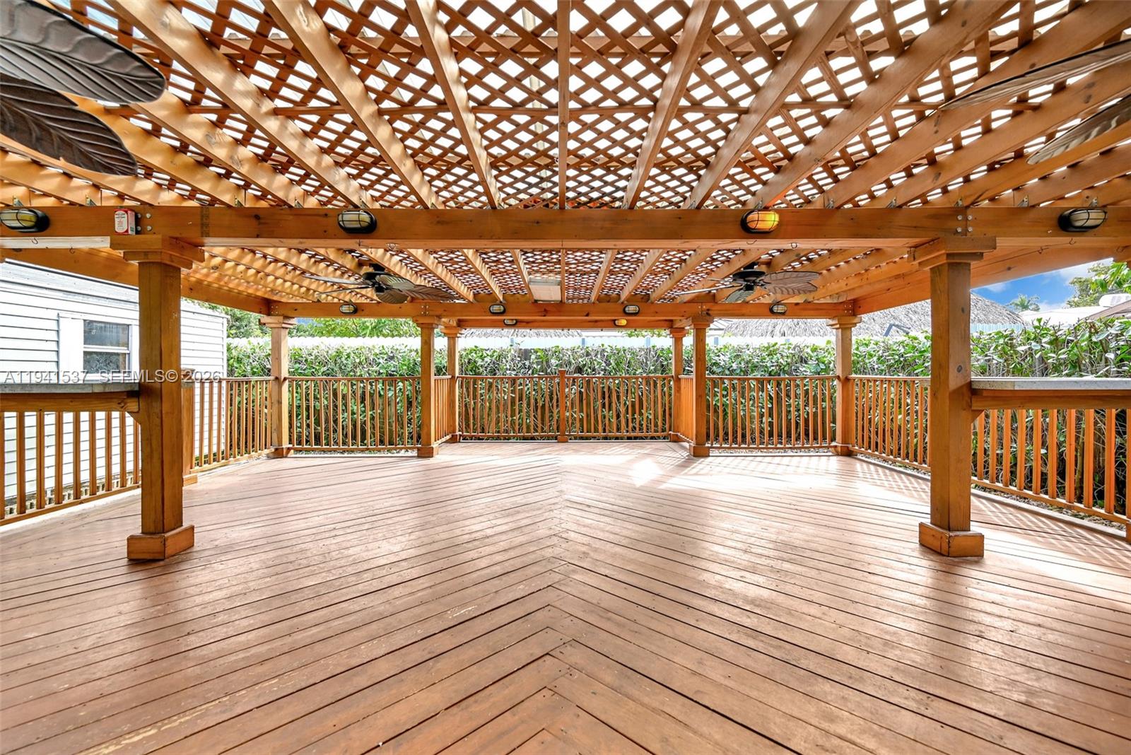 6560 Southwest 39th Street Miami, FL 33155 - Photo 15 of 17 an empty room with wooden floor and windows
