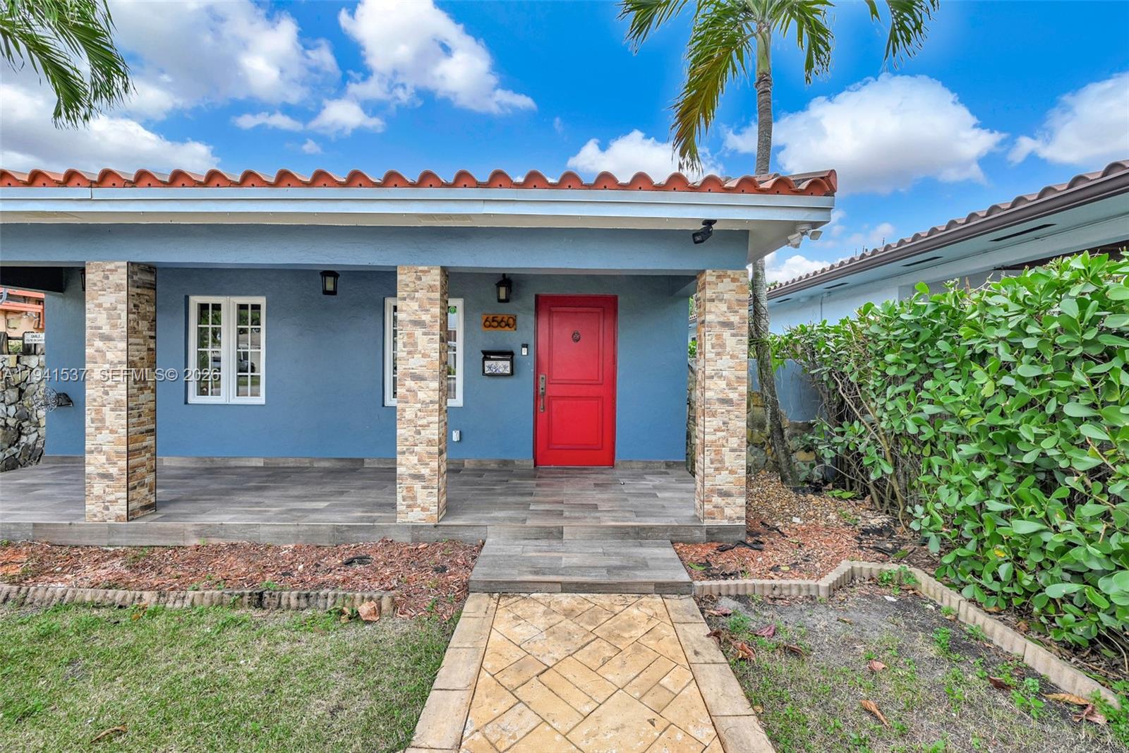 6560 Southwest 39th Street Miami, FL 33155 - Photo 3 of 17 a view of a building with potted plants